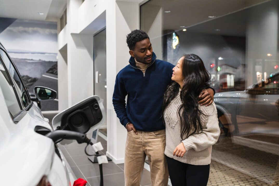 couple-choosing-electric-car-dealership-embracing-sustainable-transportation-198115-5593-1.jpg