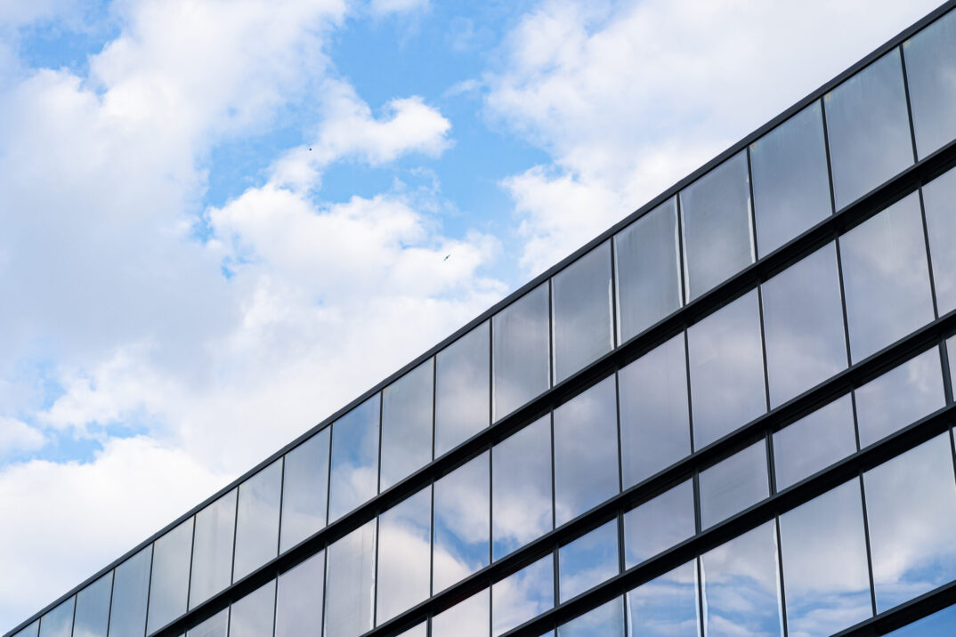 Facade glass building background on a blue sky